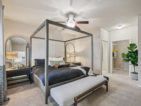 Luxury primary bedroom with modern finishes at Village at Broadstone Station apartments in Apex, NC