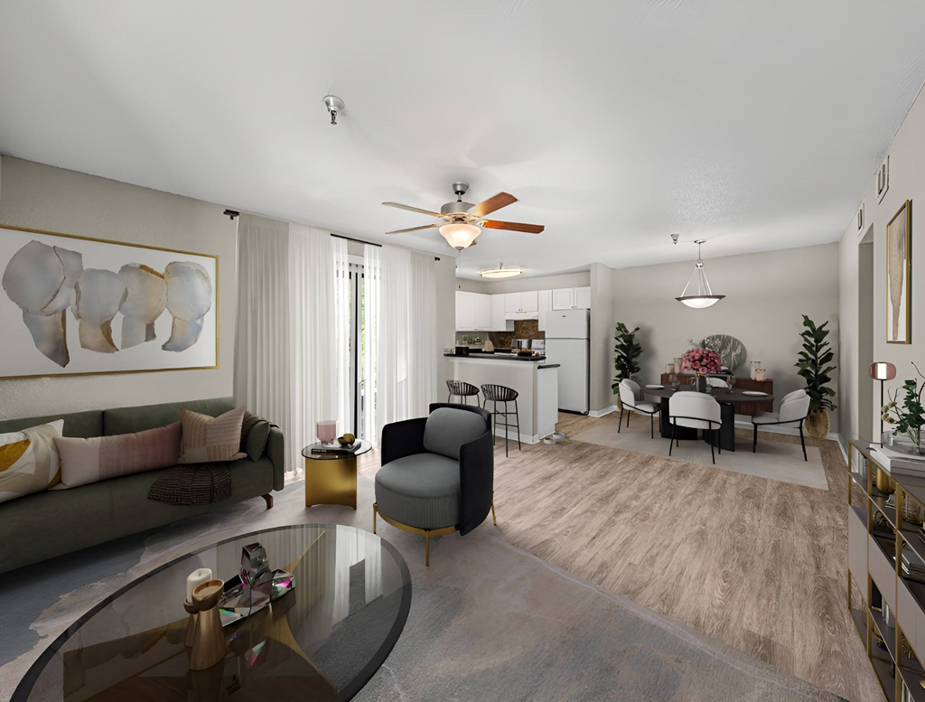 A modern living room with a glass coffee table and a grey sofa.
