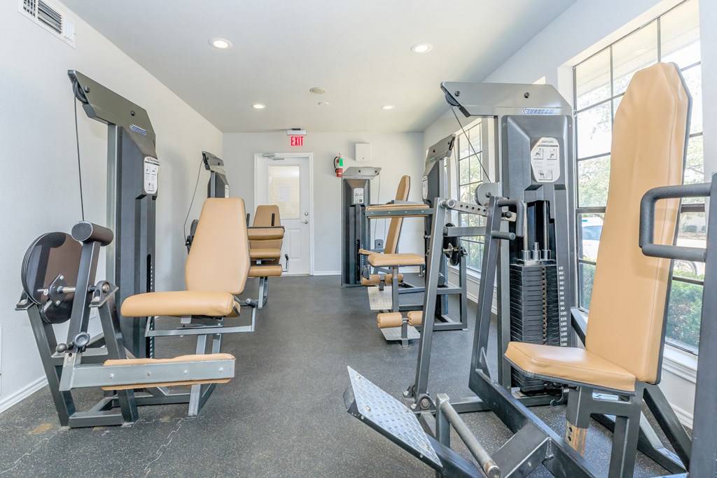 the gym at the enclave at woodbridge apartments in sugar land, tx