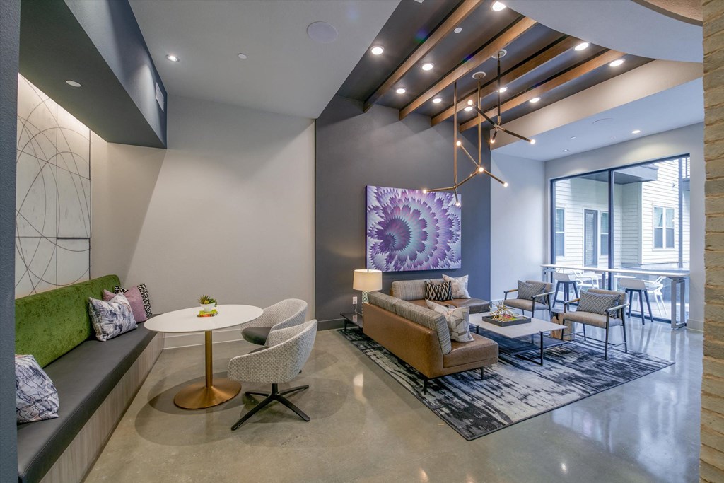 a living room with couches and chairs and a table