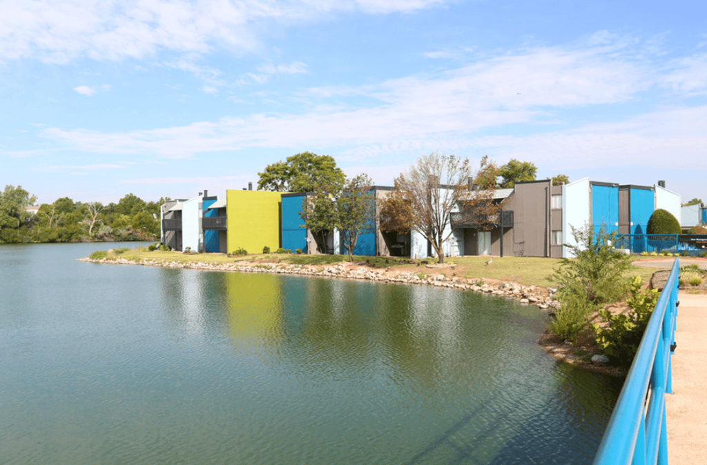 a group of buildings next to a body of water