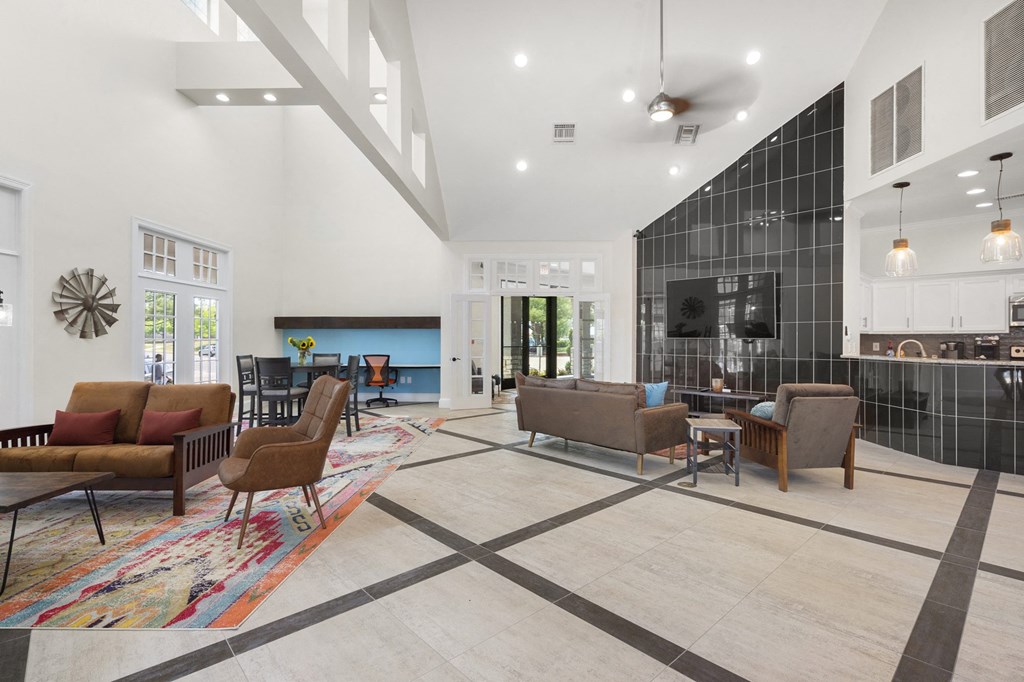 A modern living room with a black and white checkered floor.