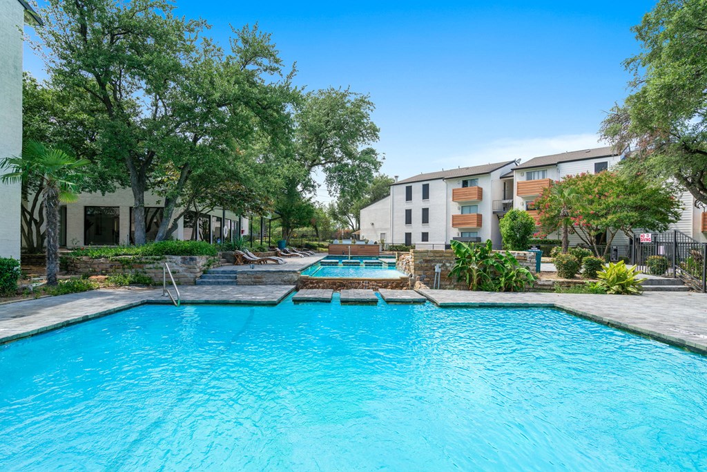 Tides at Esperanza community pool and hot tub with apartment buildings in the background