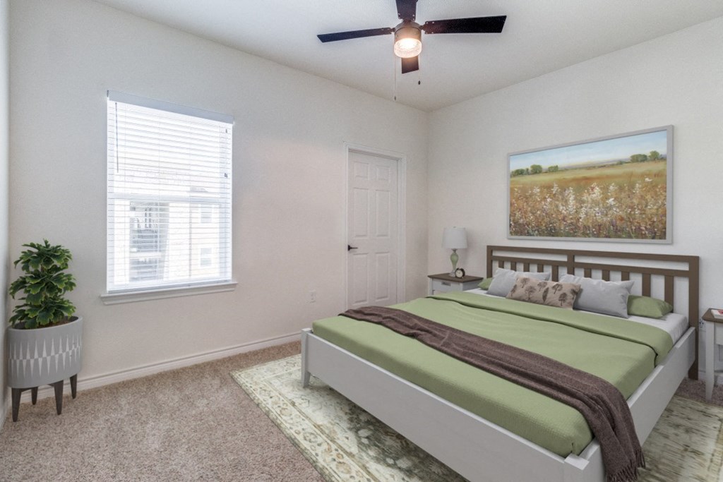 a bedroom with a bed and a ceiling fan