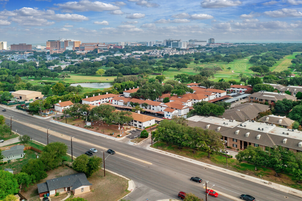 an aerial view of a city with an intersection