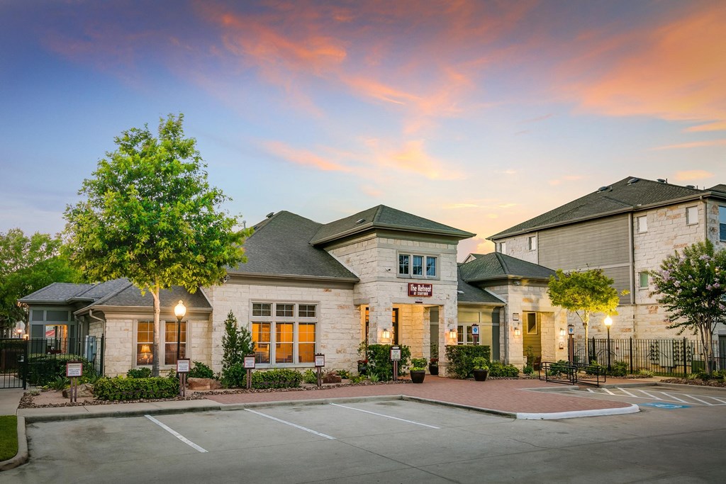a building with a parking lot in front of it