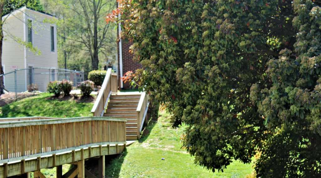 a set of stairs in a yard next to a house