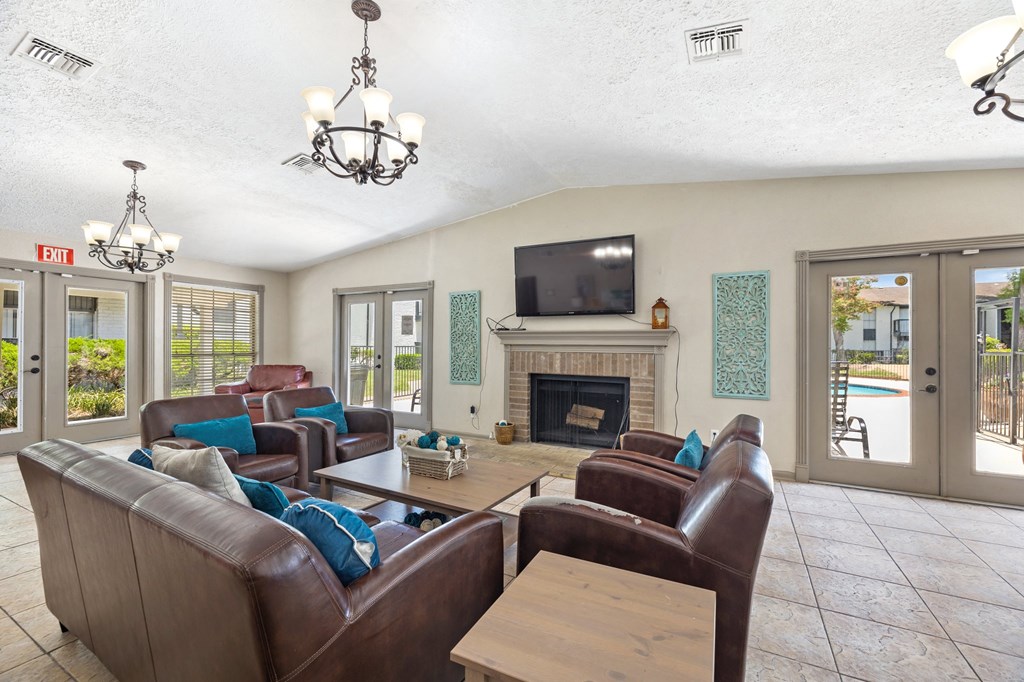 a living room with a rug and a fireplace