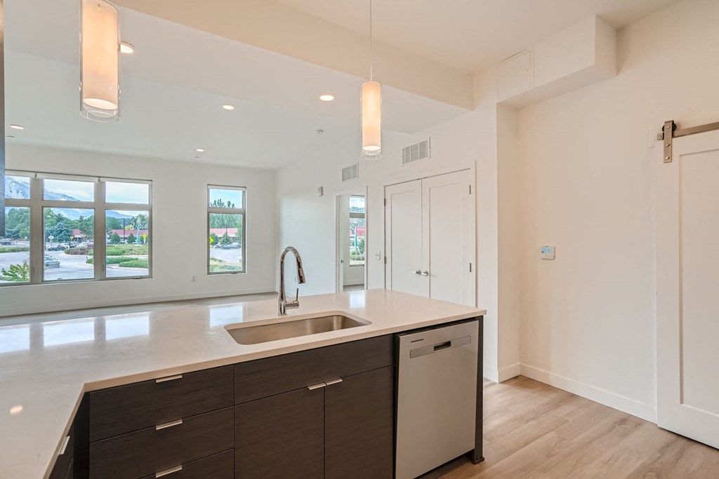a kitchen with white walls and white countertops