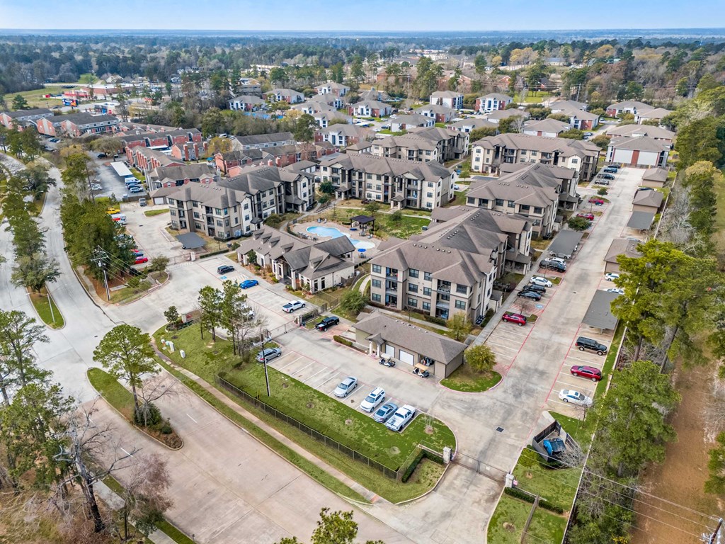 A bird's eye view of a residential area with houses and cars.