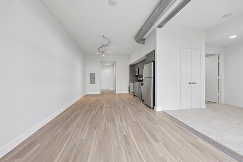 A kitchen area with a refrigerator, oven, and sink.