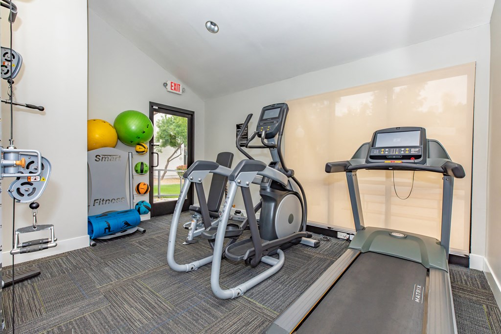 the gym at the enclave at woodbridge apartments in sugar land, tx