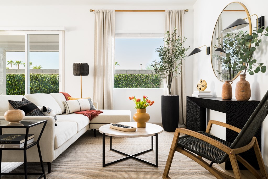a living room with a white couch and a table