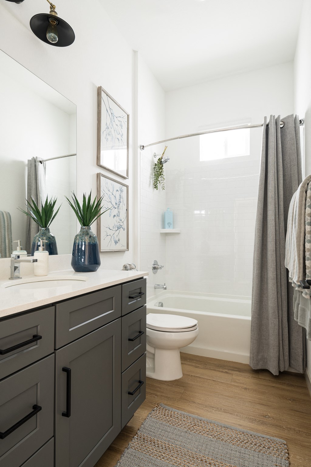 a bathroom with a white toilet and a shower