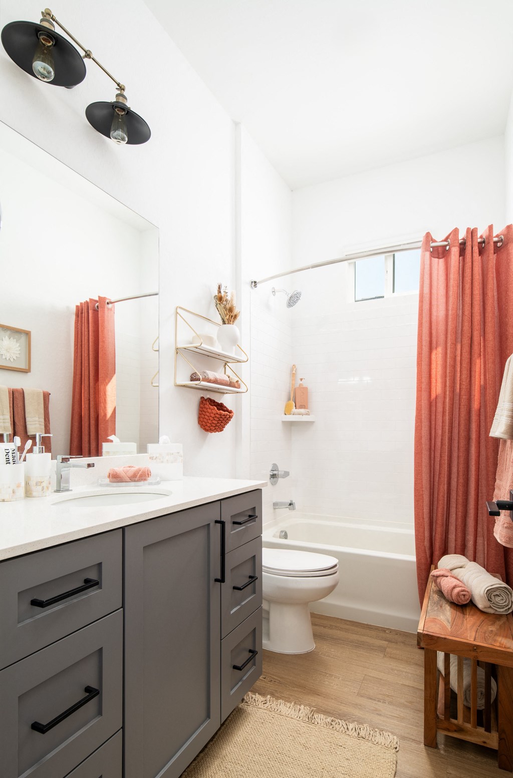 a bathroom with a shower and a sink and a toilet