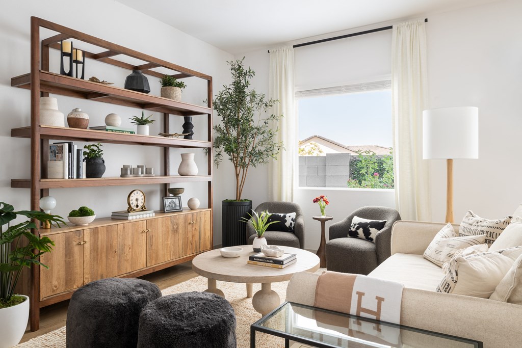 a living room with a couch and a table and a bookshelf