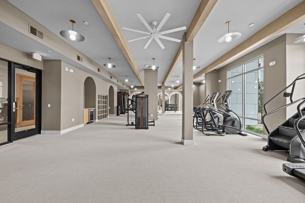 A spacious gym with treadmills and exercise equipment.