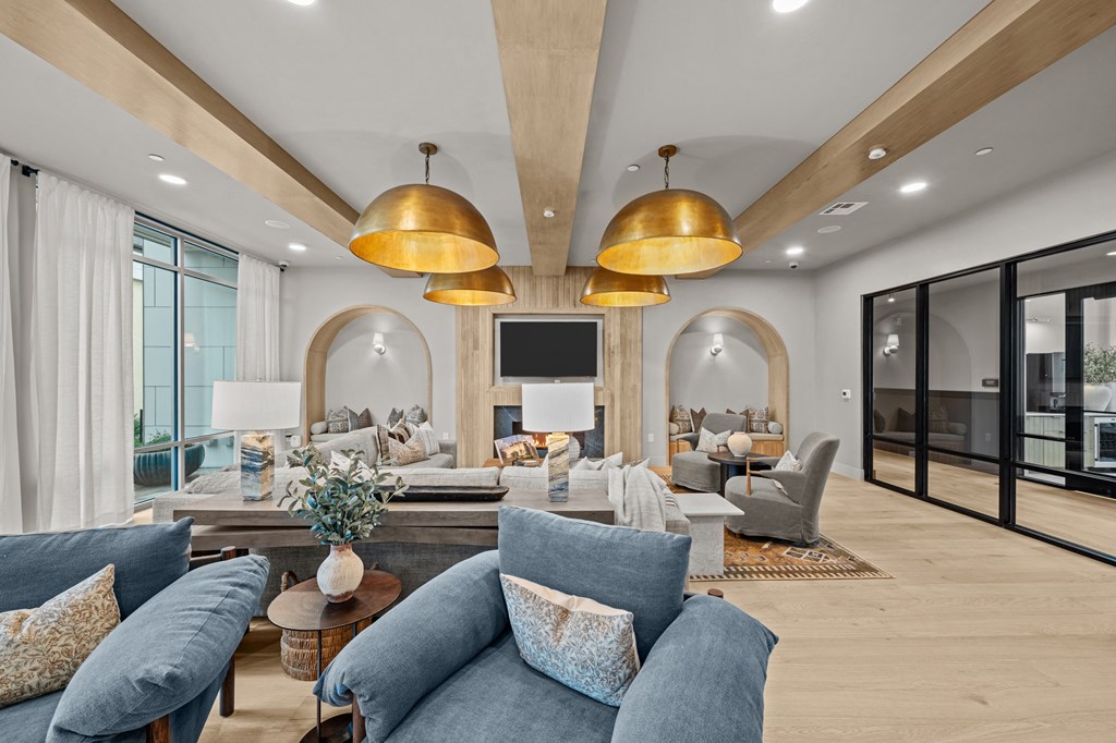 A living room with a blue couch and a television.