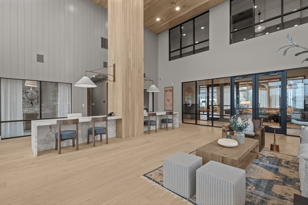 A modern living room with a large window overlooking the city.