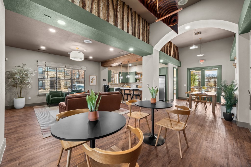 A modern office space with wooden floors and furniture.