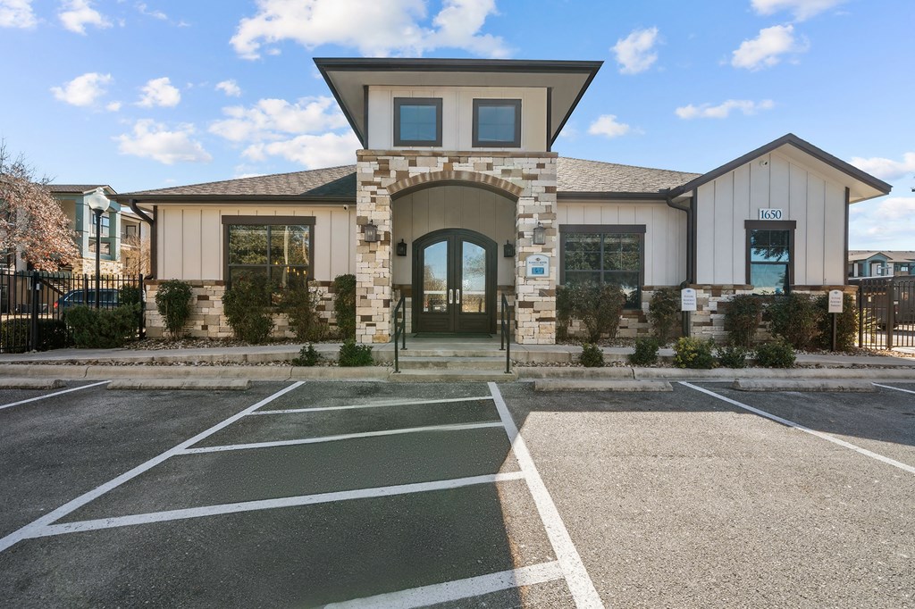 A building with a stone archway entrance and a sign that reads "1800" on the right side.
