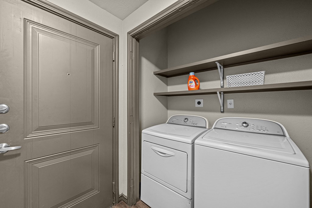 A laundry room with a washer and dryer.