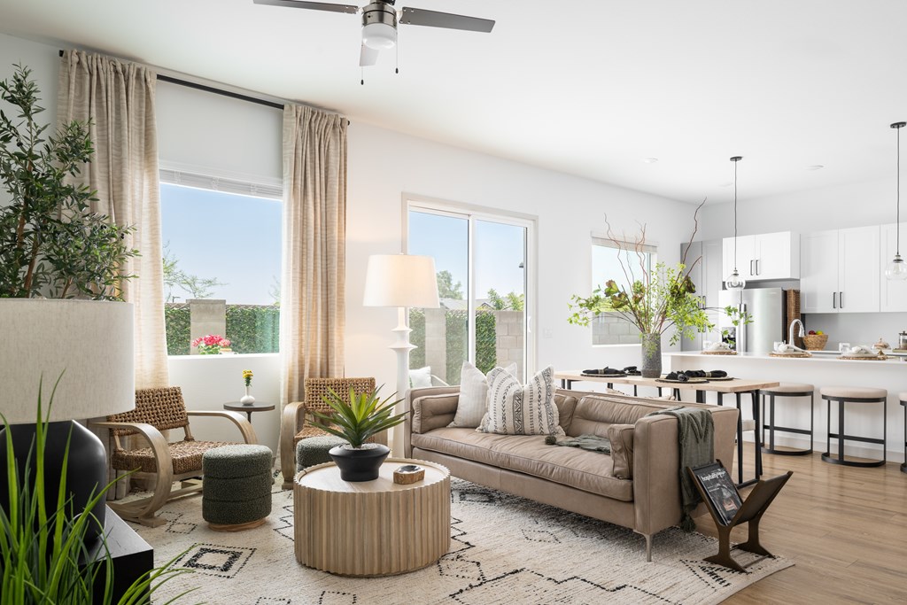 A modern living room with a sofa, chairs, and a coffee table.