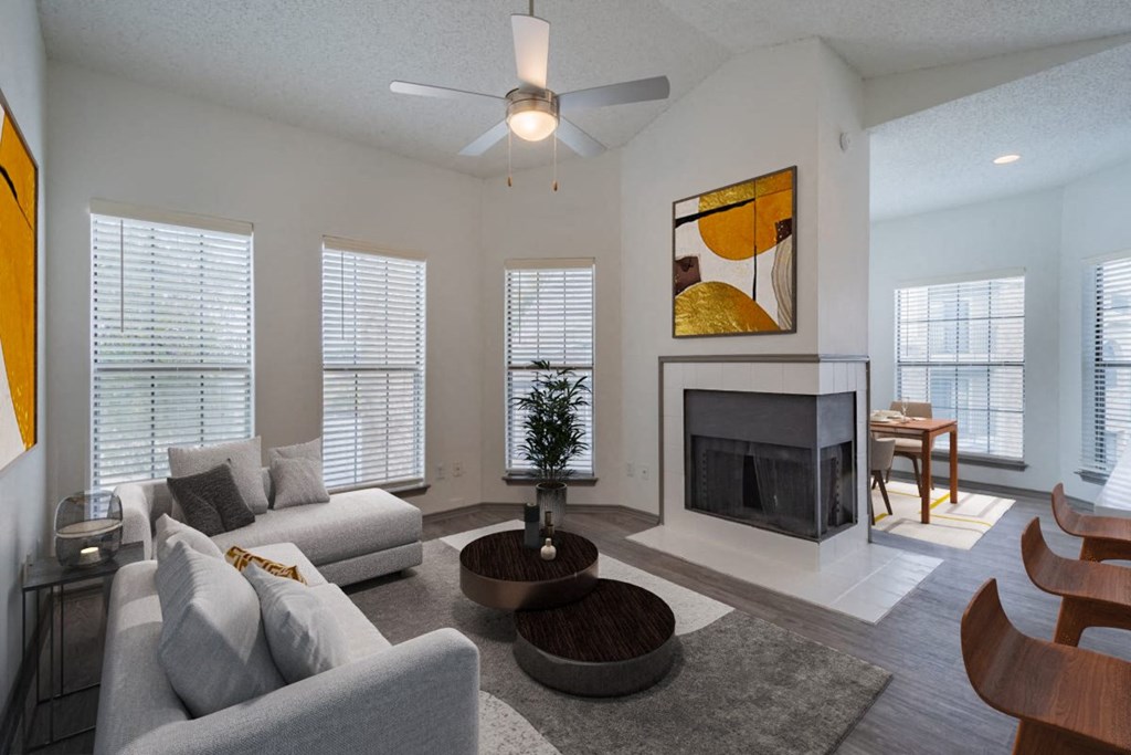 a living room with a couch and a table and a fireplace