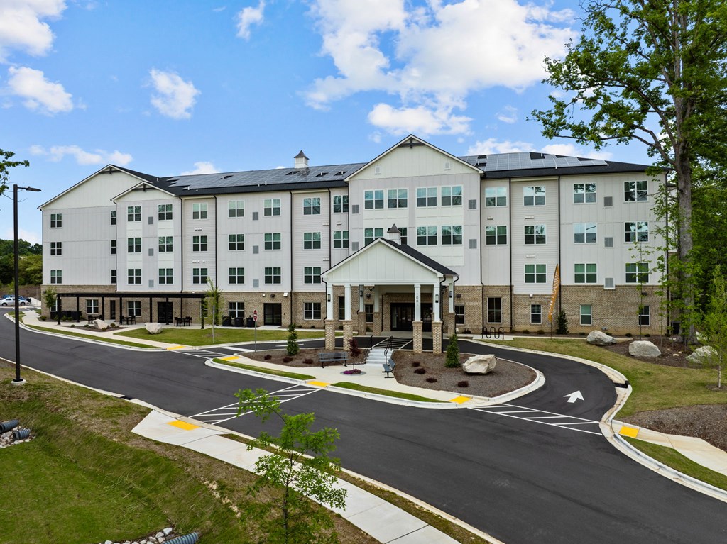 a large building with a street in front of it