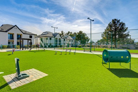 a playground at the enclave at woodbridge apartments in sugar land, tx