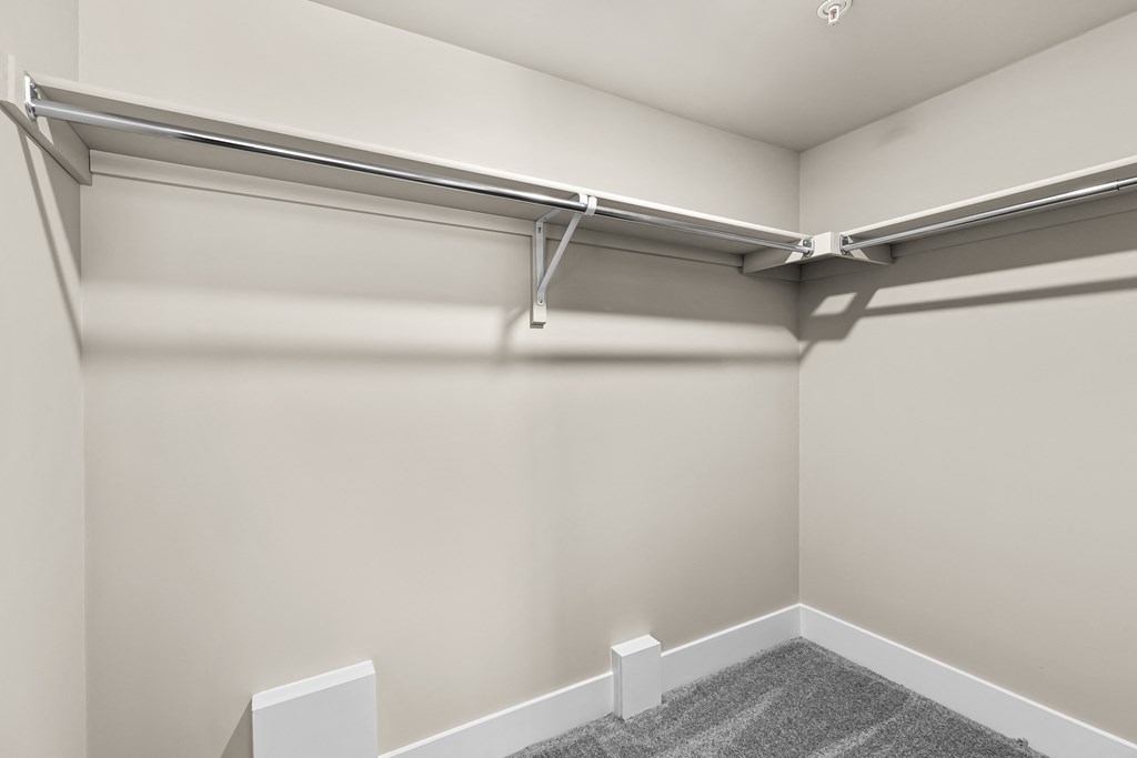 an empty garage with white walls and a white garage door