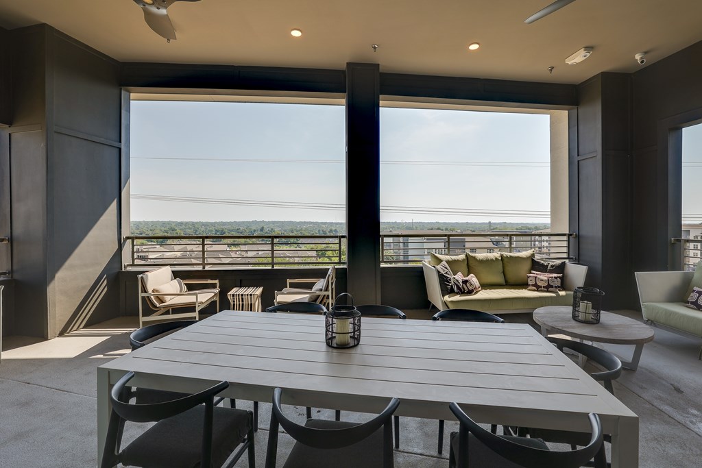 A modern dining room with a table set for six.