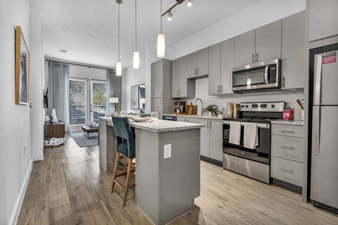 a kitchen with stainless steel appliances and a counter top