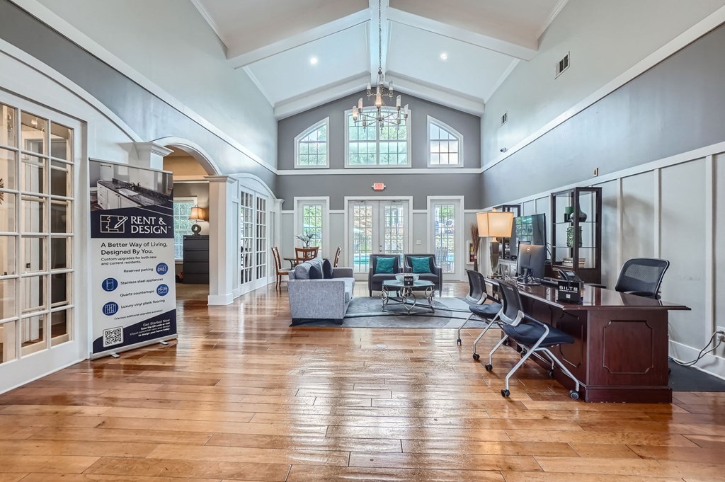 A large open space with a sign that says "21 RENT & LIVE Design A Better Way of Living".