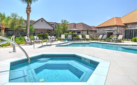 A swimming pool with a ladder and a diving board.