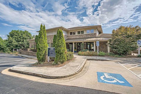 A building with a parking space in front of it.