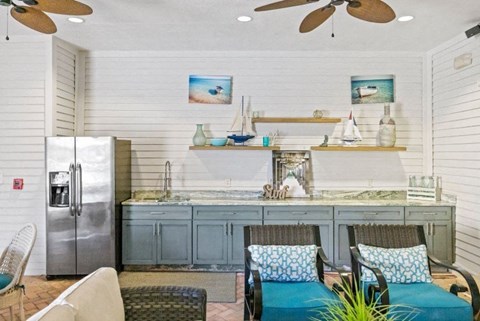 a kitchen with a table and chairs and a refrigerator