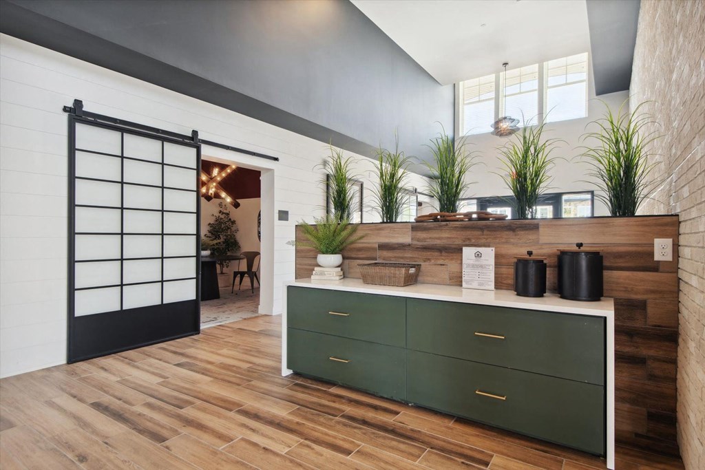 a kitchen with a counter and a sliding door