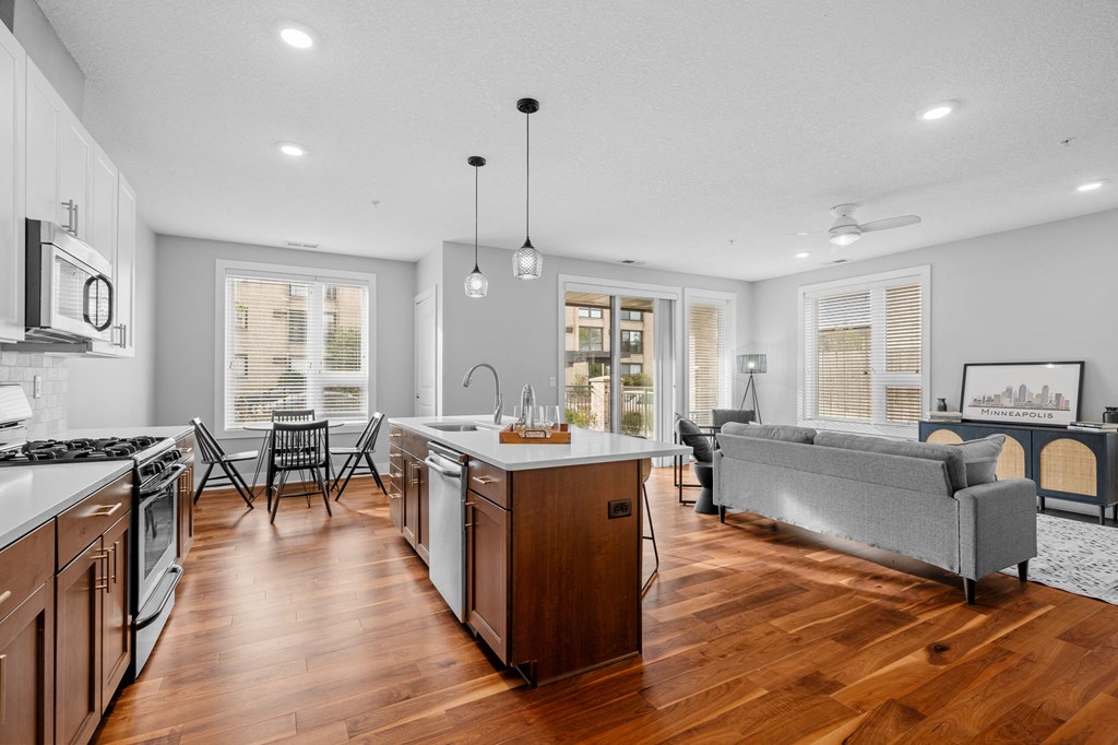 a living room with a kitchen and a dining room