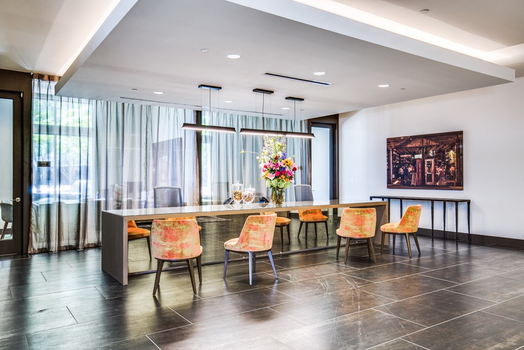 a large dining room with a long table and chairs