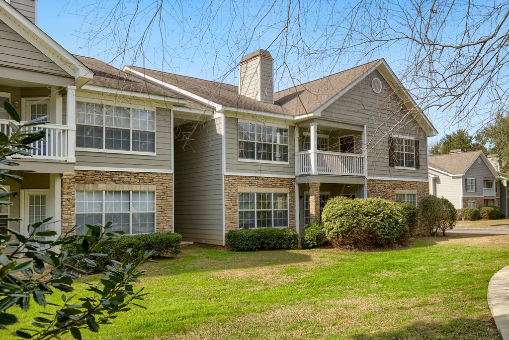 a large house with a yard in front of it