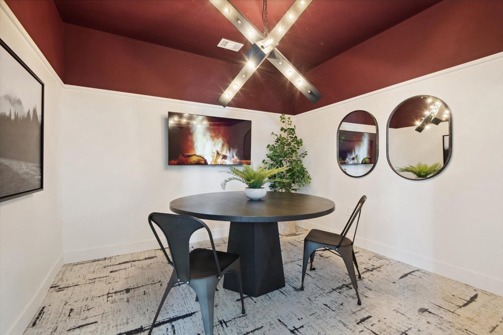 a dining room with a table and chairs and a fireplace