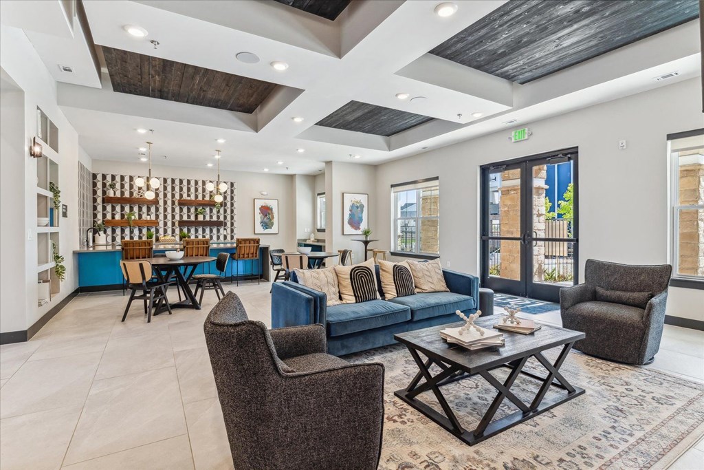 a living room with couches and chairs and a table