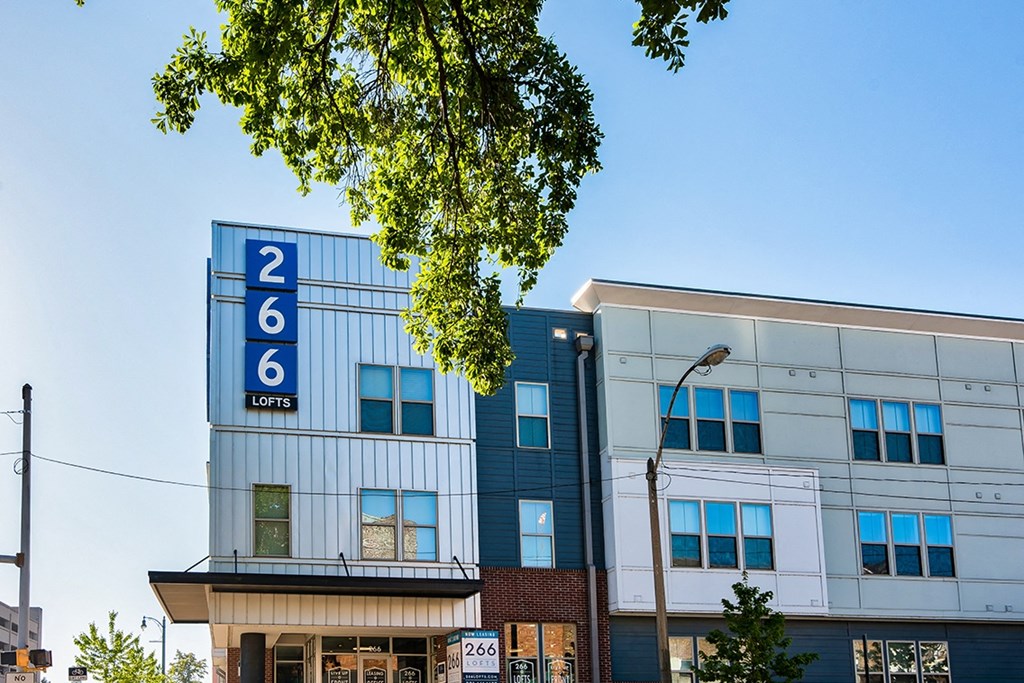 the facade of a building with a sign that reads 2 6 commons