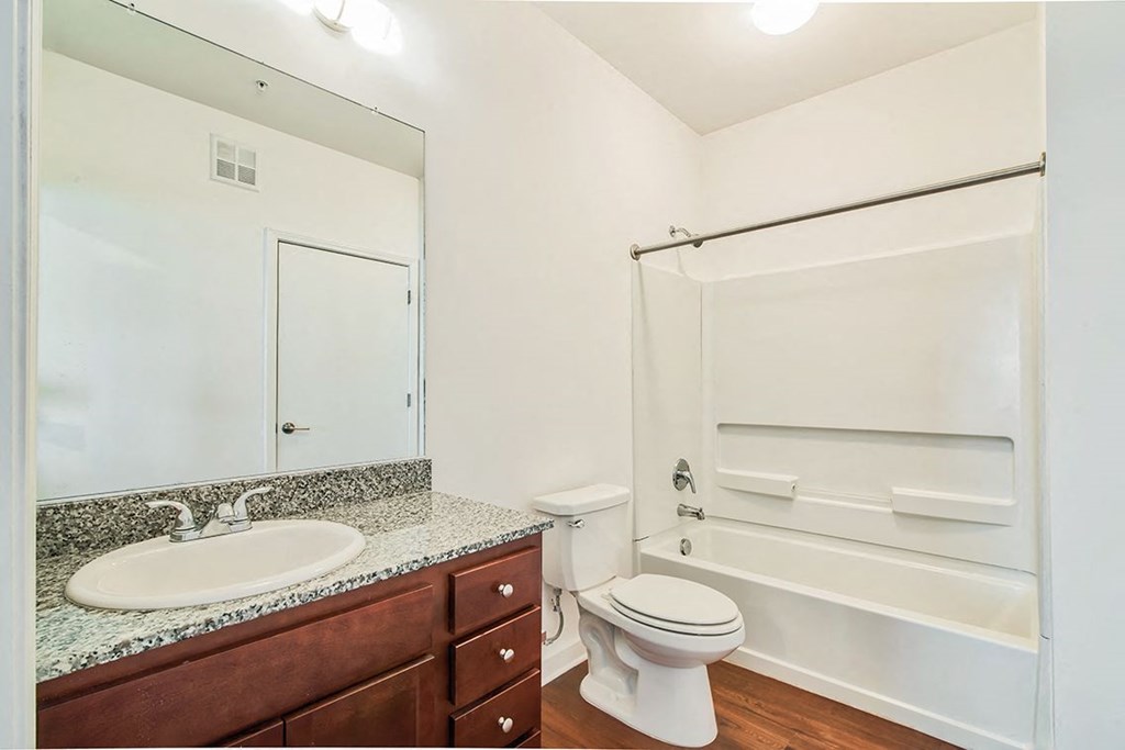 a bathroom with a sink toilet and a shower