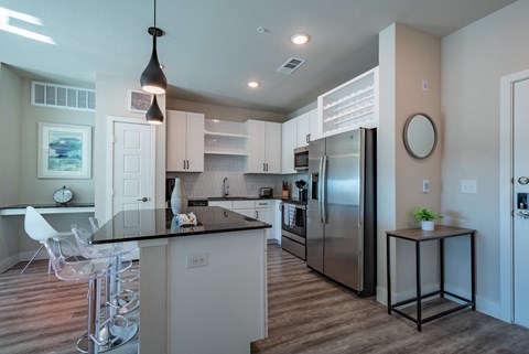 a kitchen with stainless steel appliances and a counter top