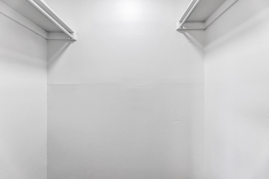 A white wall with a light on top.