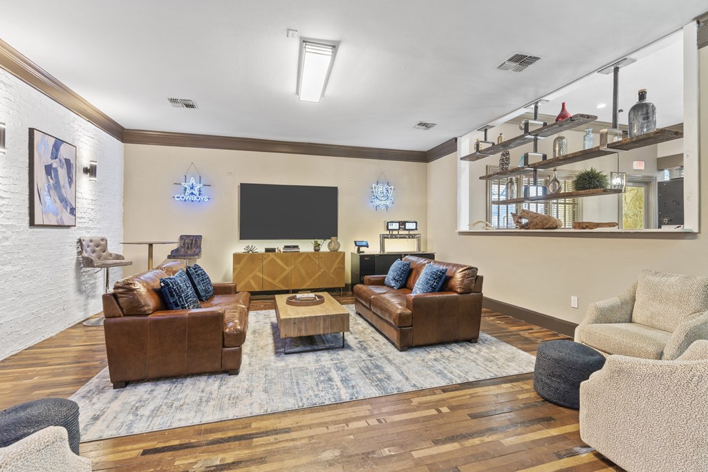 the reserve at city center spacious living room with couches and a tv