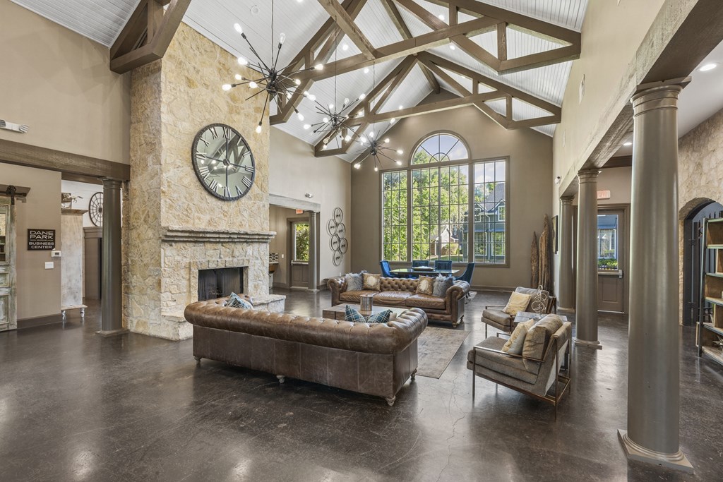 the living room of a house with couches and a fireplace