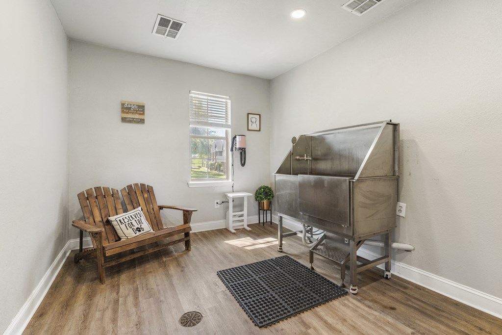 a living room with a piano and a chair